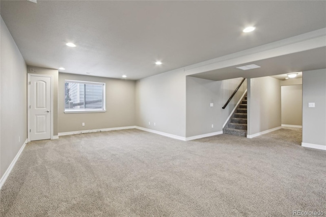 below grade area featuring baseboards, recessed lighting, carpet, and stairway
