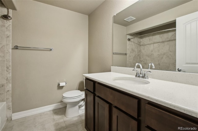 bathroom with vanity, toilet, marble finish floor, baseboards, and visible vents