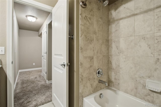 full bathroom with baseboards and shower / bathing tub combination