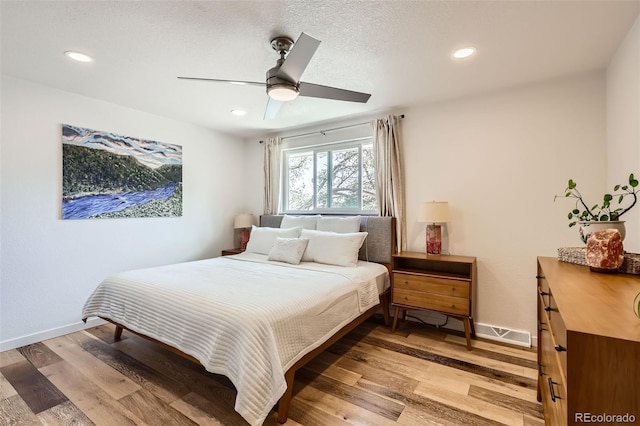 bedroom featuring recessed lighting, baseboards, and light wood finished floors