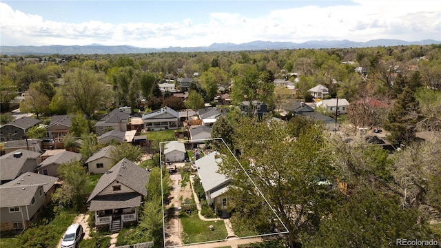 2235 Eaton St, Edgewater, CO 80214 - aerial view of residential area with mountains and a heavily wooded area