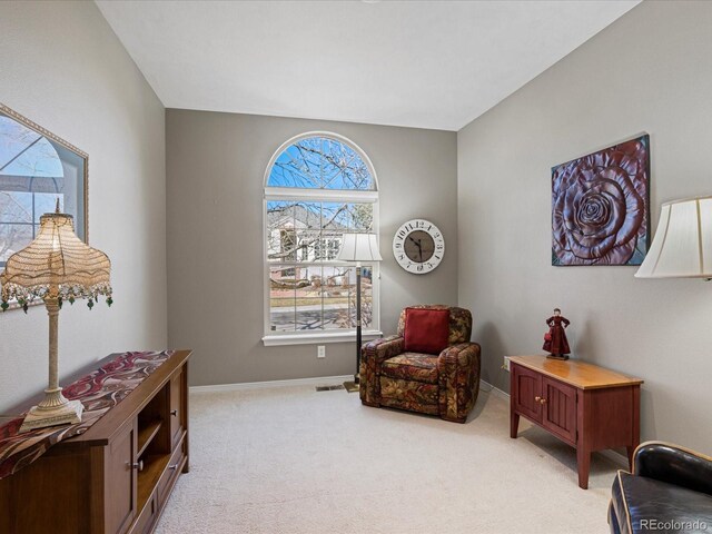 sitting room with light colored carpet