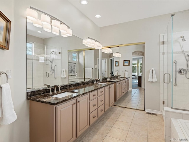 bathroom with tile patterned floors, an enclosed shower, and vanity