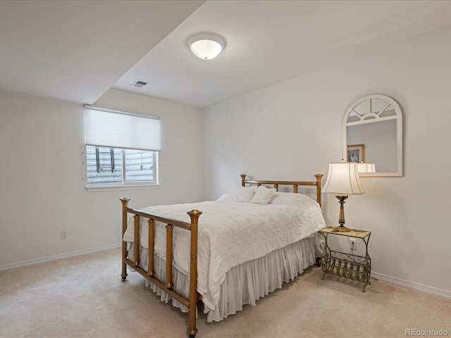 bedroom with light carpet