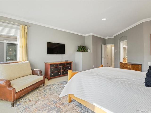 bedroom featuring crown molding and light carpet