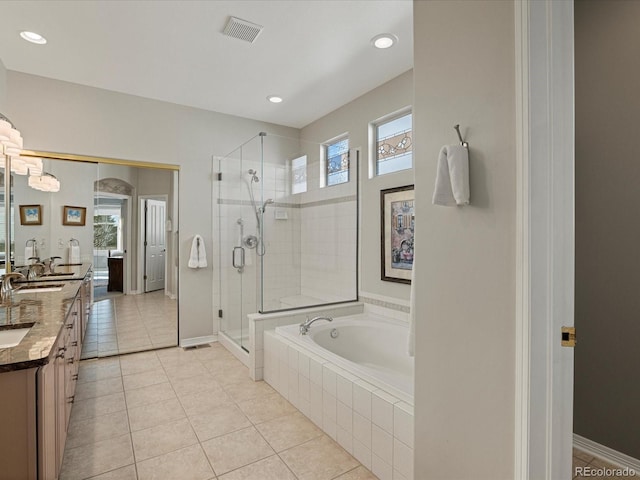 bathroom with vanity, shower with separate bathtub, and tile patterned floors