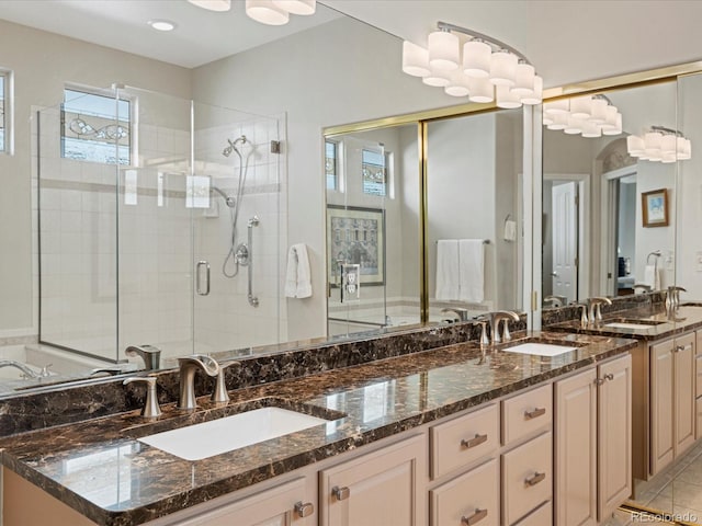 bathroom with vanity, tile patterned floors, and walk in shower