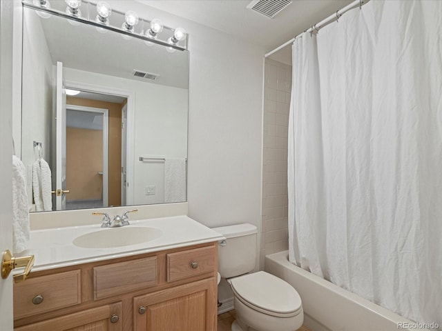 full bathroom featuring shower / bathtub combination with curtain, vanity, and toilet