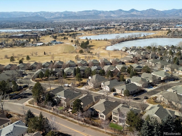 aerial view featuring a water and mountain view