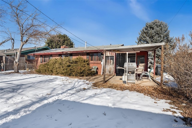 view of front of property with a sunroom