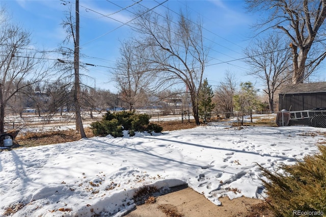 view of yard layered in snow