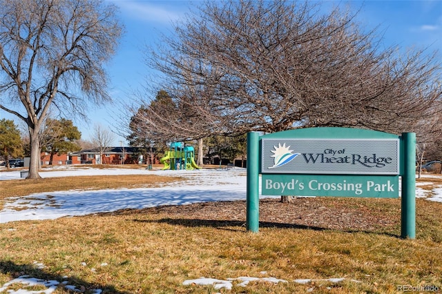 view of property's community featuring a yard and a playground