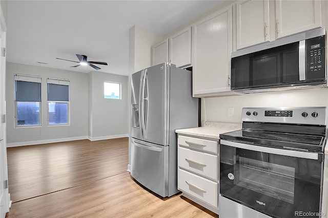 1285 W 9th Ave, Denver, CO 80204 - kitchen with appliances with stainless steel finishes, light wood-style floors, ceiling fan, and light countertops