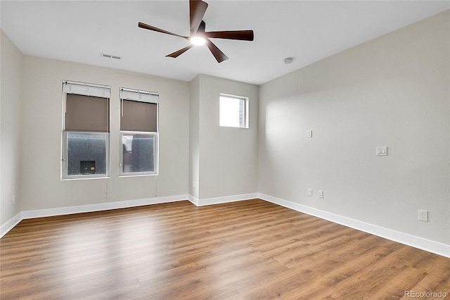 1285 W 9th Ave, Denver, CO 80204 - empty room featuring a ceiling fan, wood finished floors, and baseboards