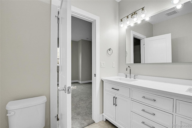 1285 W 9th Ave, Denver, CO 80204 - bathroom with vanity, toilet, and baseboards