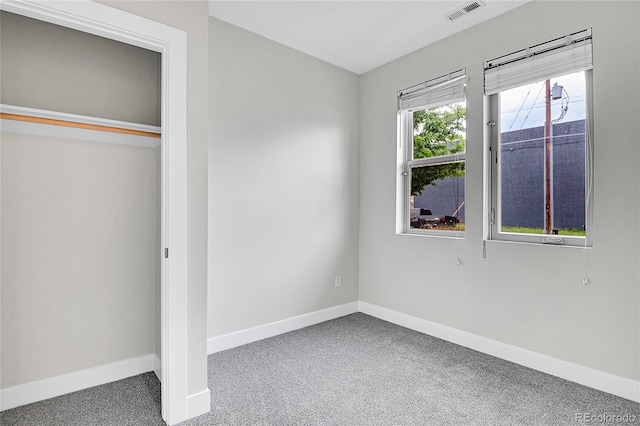 1285 W 9th Ave, Denver, CO 80204 - unfurnished bedroom with carpet floors, baseboards, and a closet