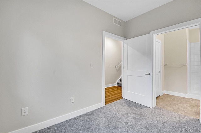 1285 W 9th Ave, Denver, CO 80204 - unfurnished bedroom with light colored carpet and baseboards