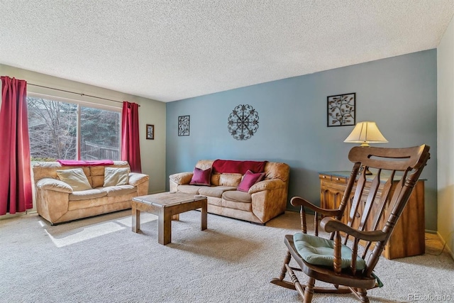 living room featuring carpet floors and a textured ceiling