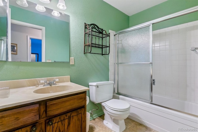 full bath with toilet, tile patterned flooring, enclosed tub / shower combo, vanity, and a textured wall