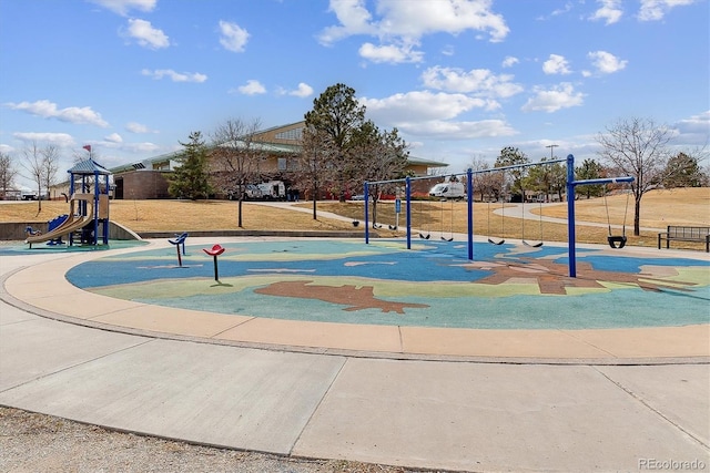 view of home's community featuring playground community