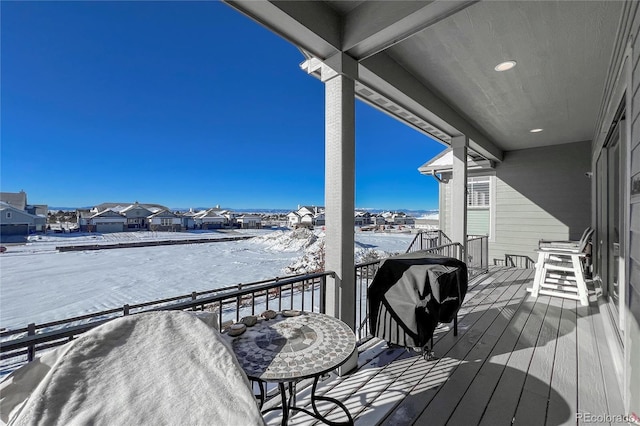 view of snow covered deck