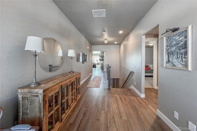 hallway featuring wood-type flooring