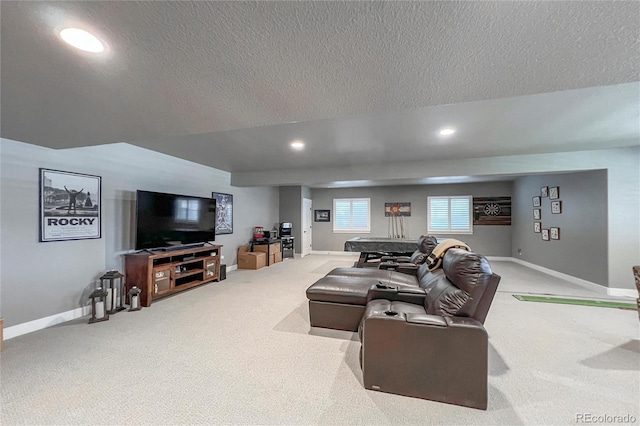 living room featuring a textured ceiling and carpet floors