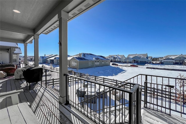 view of snow covered deck