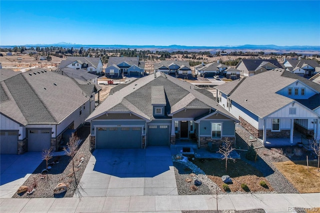 drone / aerial view with a residential view and a mountain view