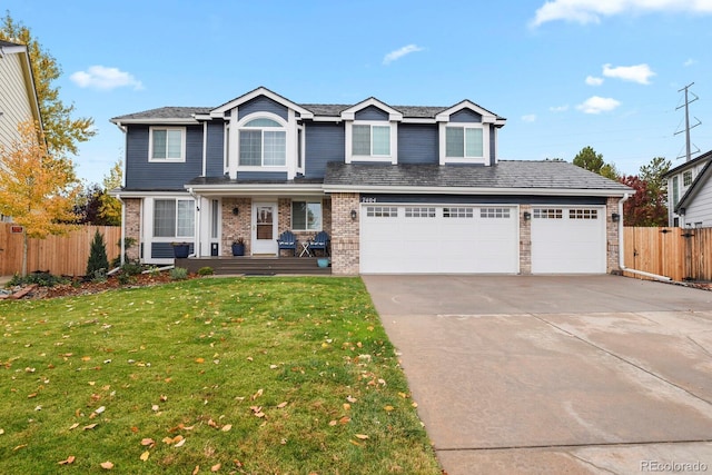 7404 La Quinta Ln, Lone Tree, CO 80124 - traditional home with driveway, covered porch, and brick siding