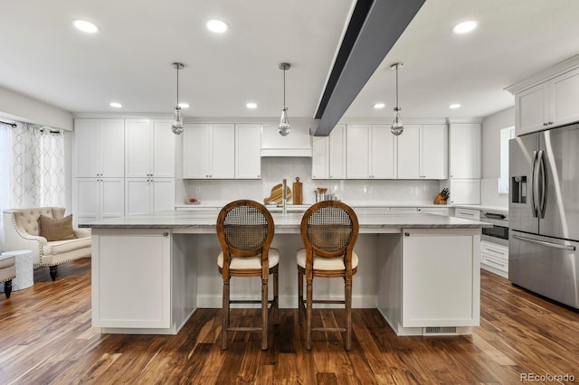 7404 La Quinta Ln, Lone Tree, CO 80124 - kitchen featuring appliances with stainless steel finishes, recessed lighting, white cabinets, pendant lighting, and dark wood-style floors