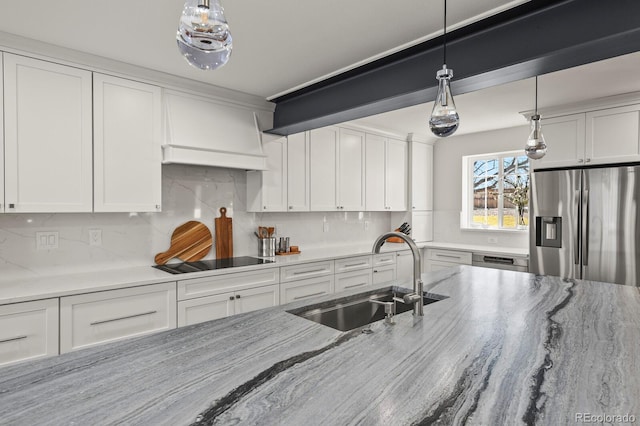 7404 La Quinta Ln, Lone Tree, CO 80124 - kitchen featuring appliances with stainless steel finishes, a sink, white cabinets, and hanging light fixtures