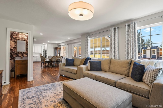 7404 La Quinta Ln, Lone Tree, CO 80124 - living room featuring plenty of natural light, dark wood-style floors, and recessed lighting