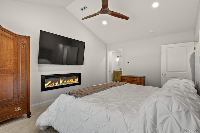 7404 La Quinta Ln, Lone Tree, CO 80124 - carpeted bedroom featuring vaulted ceiling, a glass covered fireplace, recessed lighting, ceiling fan, and baseboards