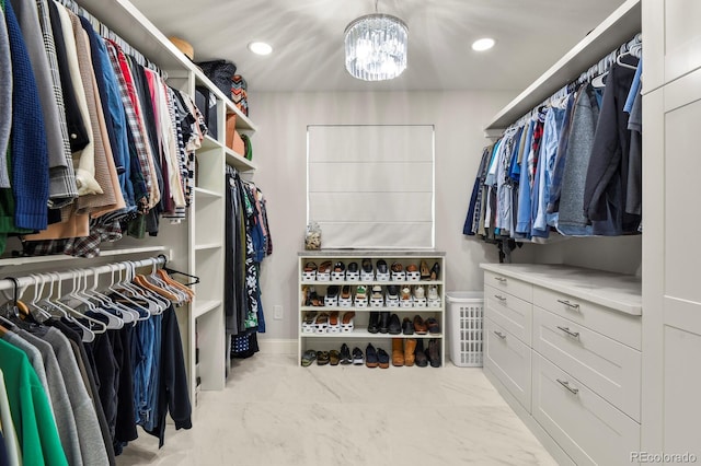 7404 La Quinta Ln, Lone Tree, CO 80124 - spacious closet featuring a chandelier