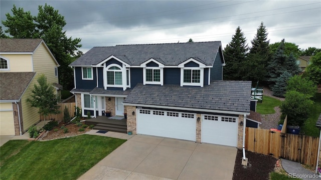 7404 La Quinta Ln, Lone Tree, CO 80124 - traditional-style house with driveway, brick siding, and an attached garage