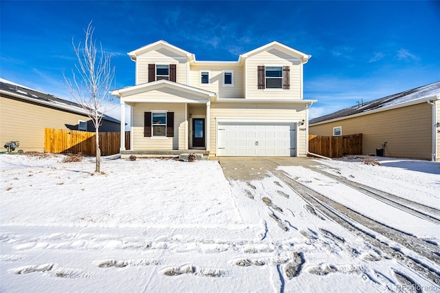 view of front of property with a garage and covered porch