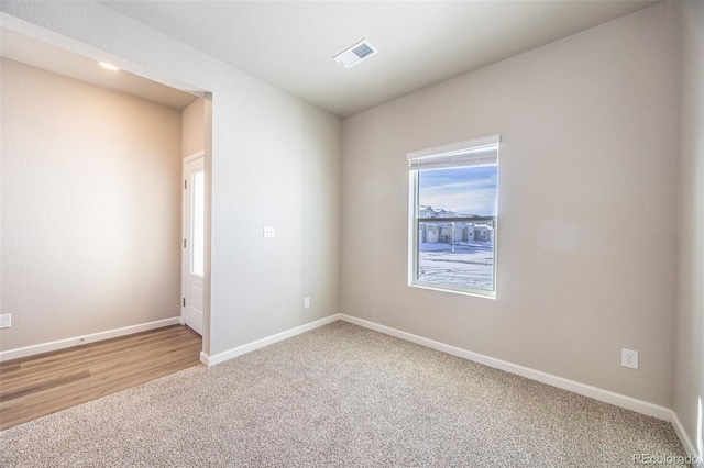 unfurnished room featuring carpet