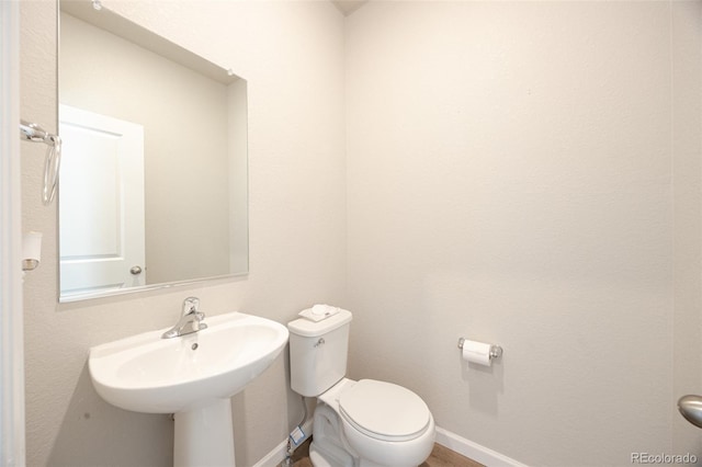 bathroom featuring toilet