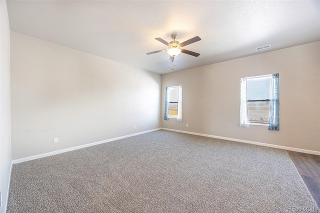 unfurnished room featuring ceiling fan and a textured ceiling