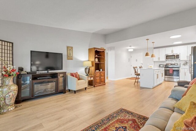 living room with light hardwood / wood-style floors