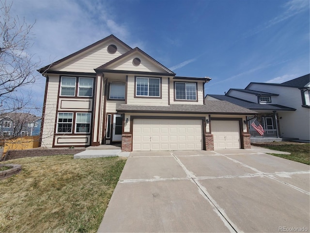 106 Cherry St, Castle Rock, CO 80104 - view of front facade with brick siding, driveway, a garage, and a front yard