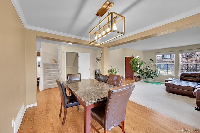 106 Cherry St, Castle Rock, CO 80104 - dining area with stairs, ornamental molding, light wood-style floors, and a chandelier