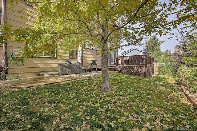 106 Cherry St, Castle Rock, CO 80104 - view of green lawn with a wooden deck and a patio area