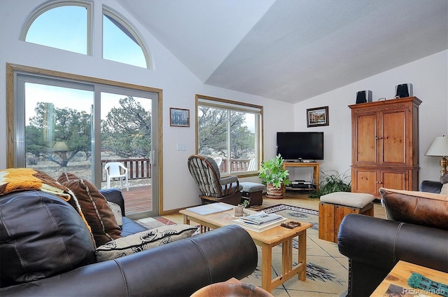 living room featuring lofted ceiling and light tile patterned floors