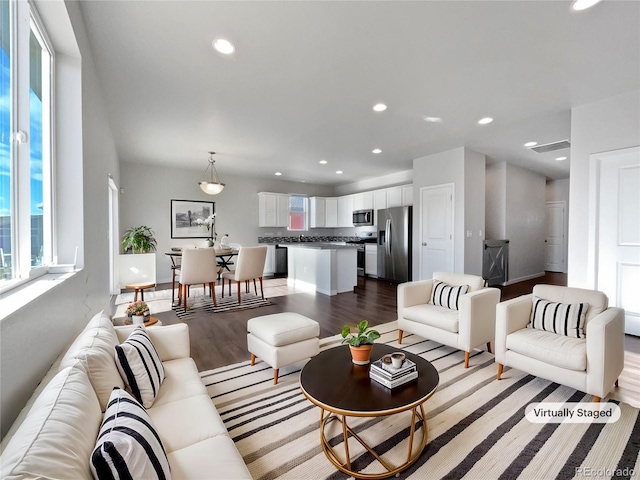 living room with light hardwood / wood-style flooring