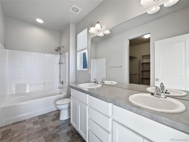 full bathroom with toilet, vanity, and shower / bathtub combination