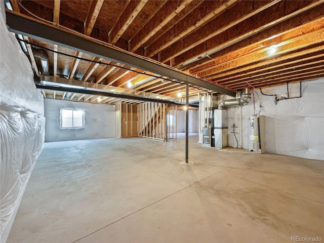 basement with water heater and heating unit