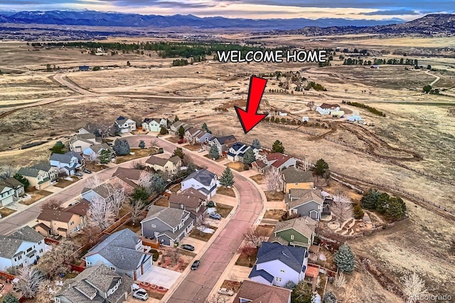 aerial view with a mountain view and a residential view