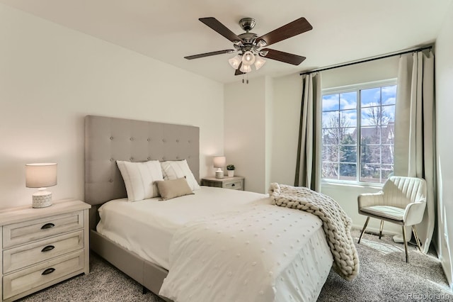 bedroom with a ceiling fan and light colored carpet